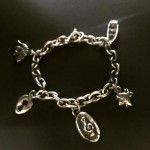 Charm bracelet. Handmade chain and sand-cast charms.. Sterling silver