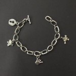 Charm bracelet. Handmade chain and sand-cast charms.. Sterling silver