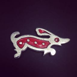 Little Red Dog.. Brooch in sterling silver and enamel… Sand cast